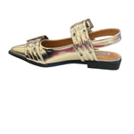 Gold pointed-toe flats with bold silver double buckle straps and a slingback backstrap, combining vibrant color with edgy charm.