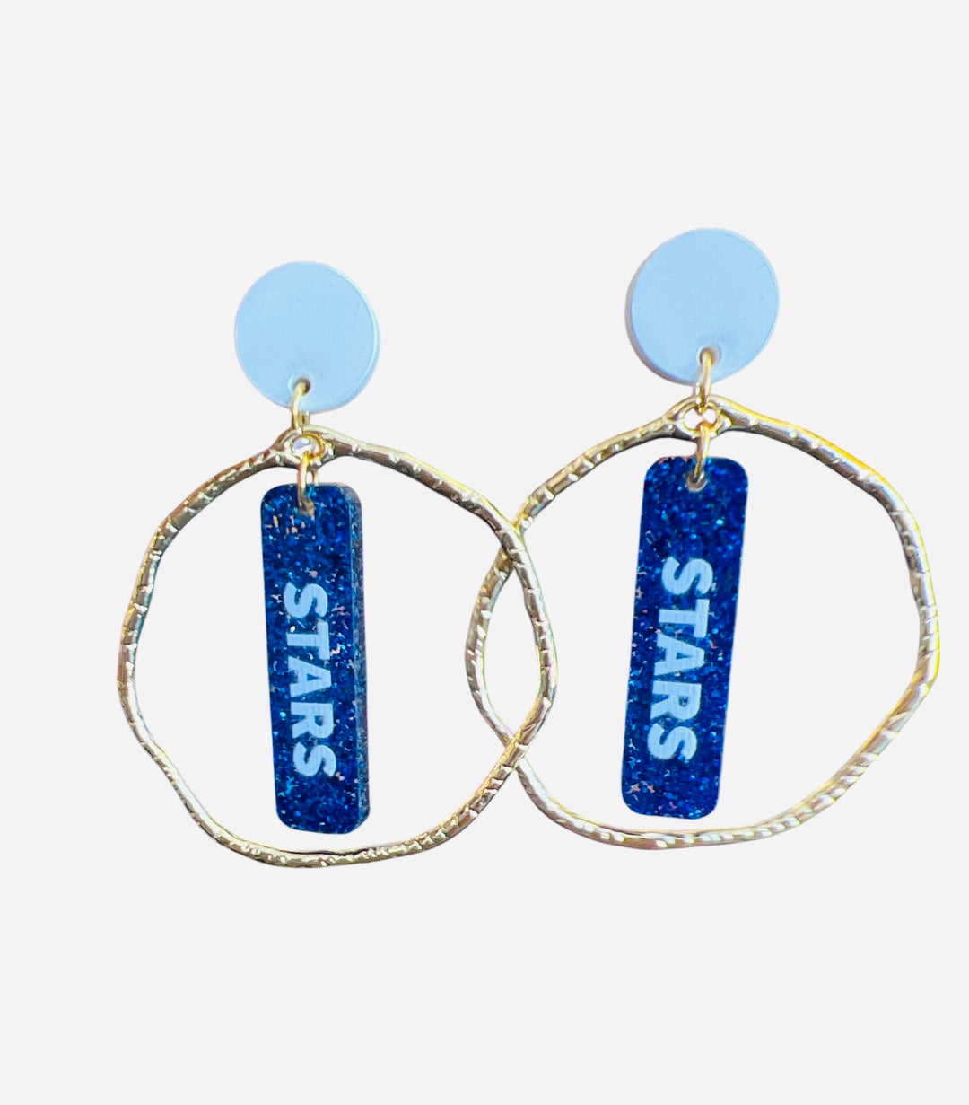 Glittery blue dangle earrings with white STARS lettering, white stud, and gold circle frame—perfect for bold game day spirit.