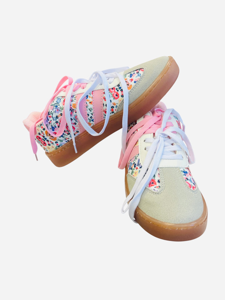 Brown and white sneakers with pink laces and a floral print design.