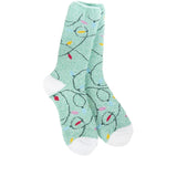 A pair of plush, soft mint green crew socks with a repeating pattern of colorful Christmas string lights.