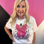 White tee with polka dot pumpkin, sparkling trim, oversized pink bow, and jeweled center.