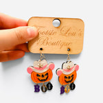 Jack-o-lantern earrings with pink cowboy hats and dangling BOO letters.