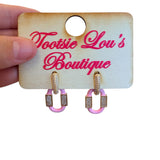 Pink enamel oval geometric earrings with gold-plated hoops and subtle rhinestone accents, lightweight and chic