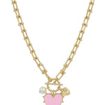 Gold chain necklace with pink enamel studded heart charm, adjustable length, and water-resistant design.