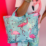 Aqua blue tote bag with pink flamingo print, hearts, and colorful chevron accents