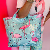 Aqua blue tote bag with pink flamingo print, hearts, and colorful chevron accents