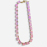 Pink crystal necklace with faceted rectangular stones and shimmering iridescent finish.