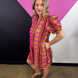 Pink mixed print mini dress with puff sleeves, contrast neckline and colorful geometric patterns.
