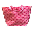 Light pink PVC tote bag with dark pink polka dots, sturdy handles, and striped sides.