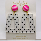 Pink striped stud earrings with black polka dot acrylic drops, lightweight and nickel-free.