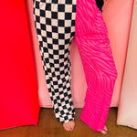 Pink zebra and checkered wide leg pants with elastic waistband.