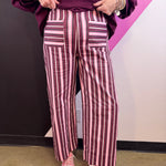 Plum pink and cream striped wide leg pants with contrasting horizontal striped patch pockets.