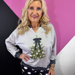 Grey Christmas pullover with green tree, black polka dot bow and matching trim.