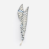 Silky cream-white scarf with black polka dots and horsebit-inspired border.
