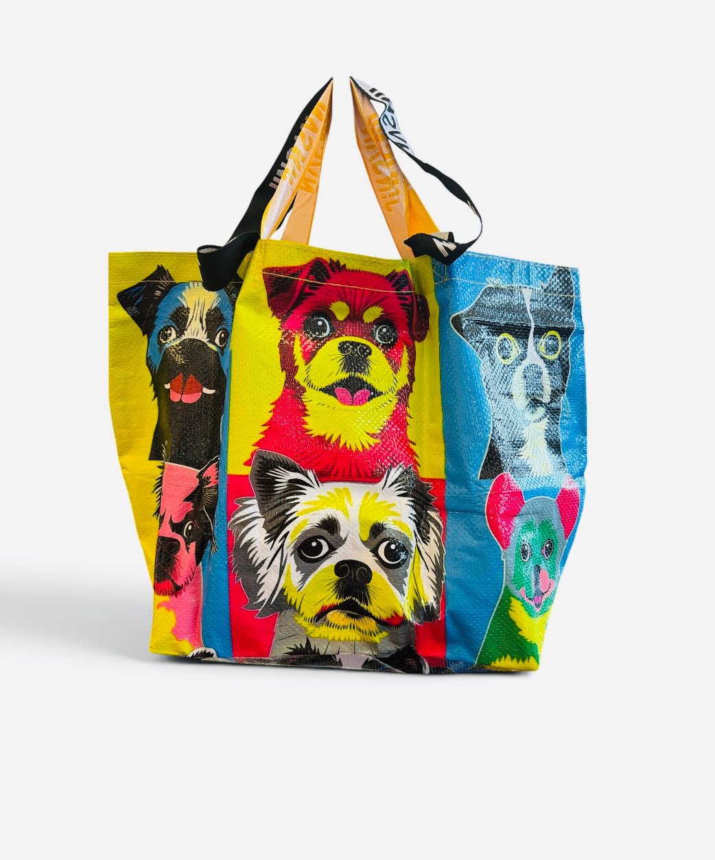 Colorful pop art tote bag featuring a collage of quirky dogs.