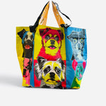 Colorful pop art tote bag featuring a collage of quirky dogs.