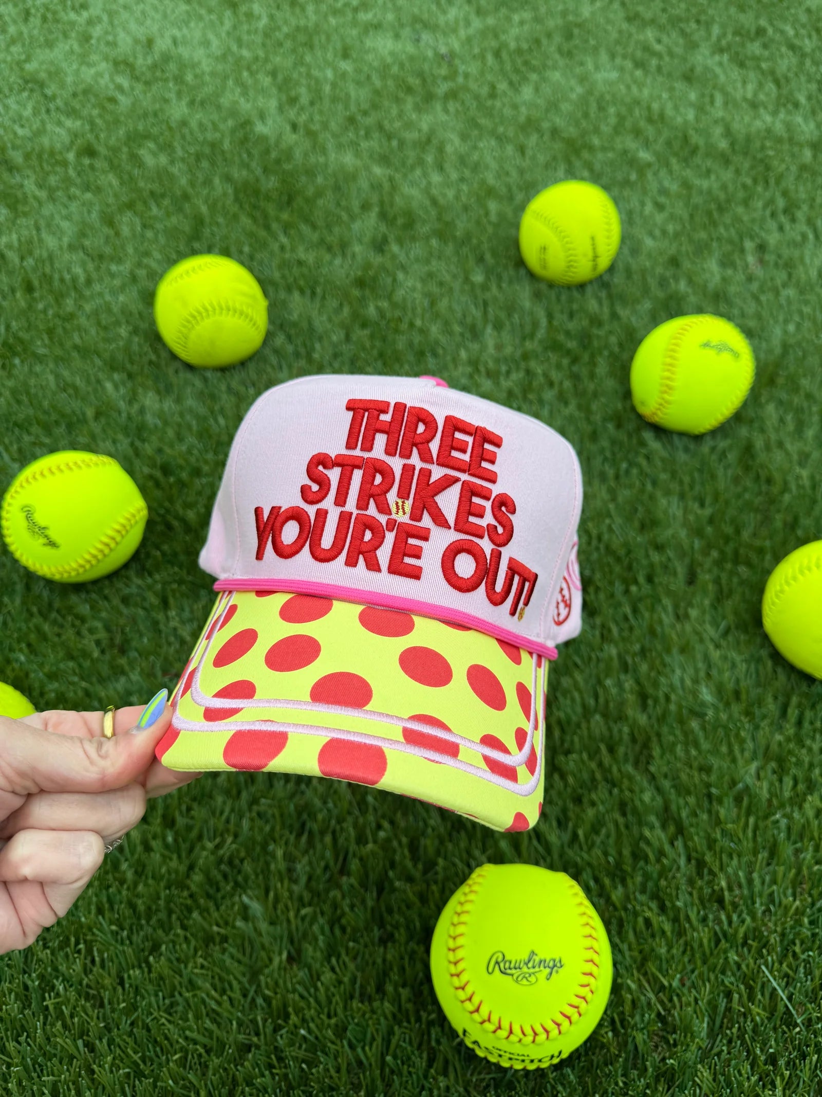 Canvas softball hat with Three Strikes You're Out embroidery and yellow polka dot bill