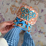 Spotted Good Day hat with bold embroidery and blue leopard print bill.