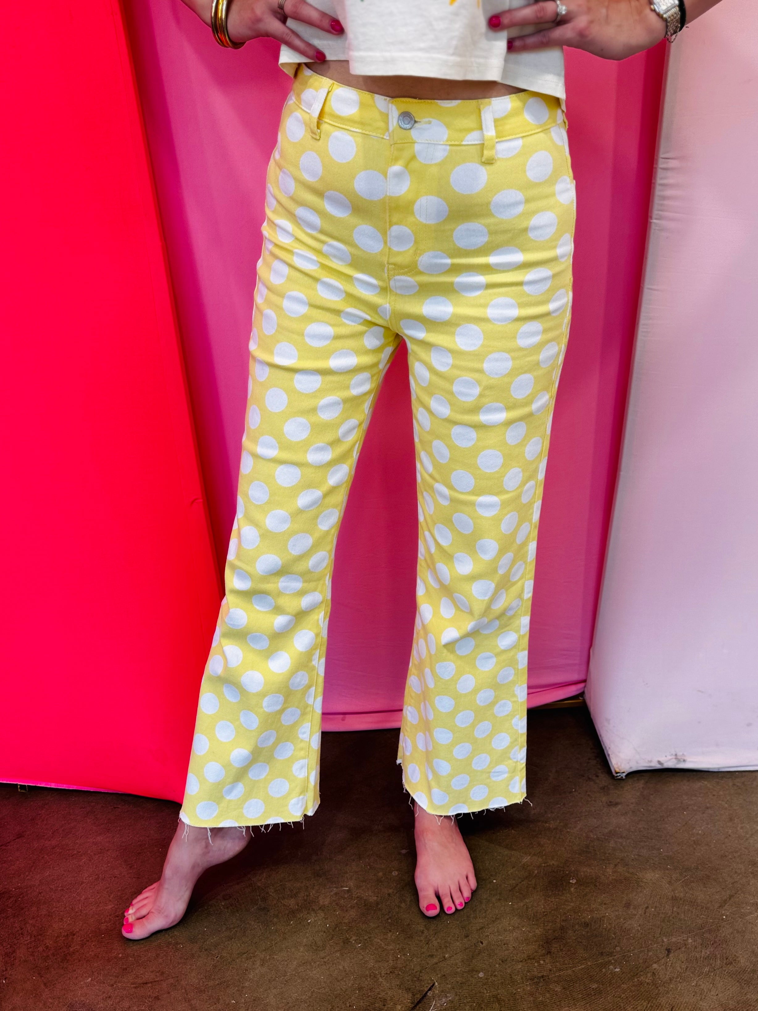 Yellow white polka dot pattern, high-waist design, and stretchy denim fabric for a flattering, comfortable fit.