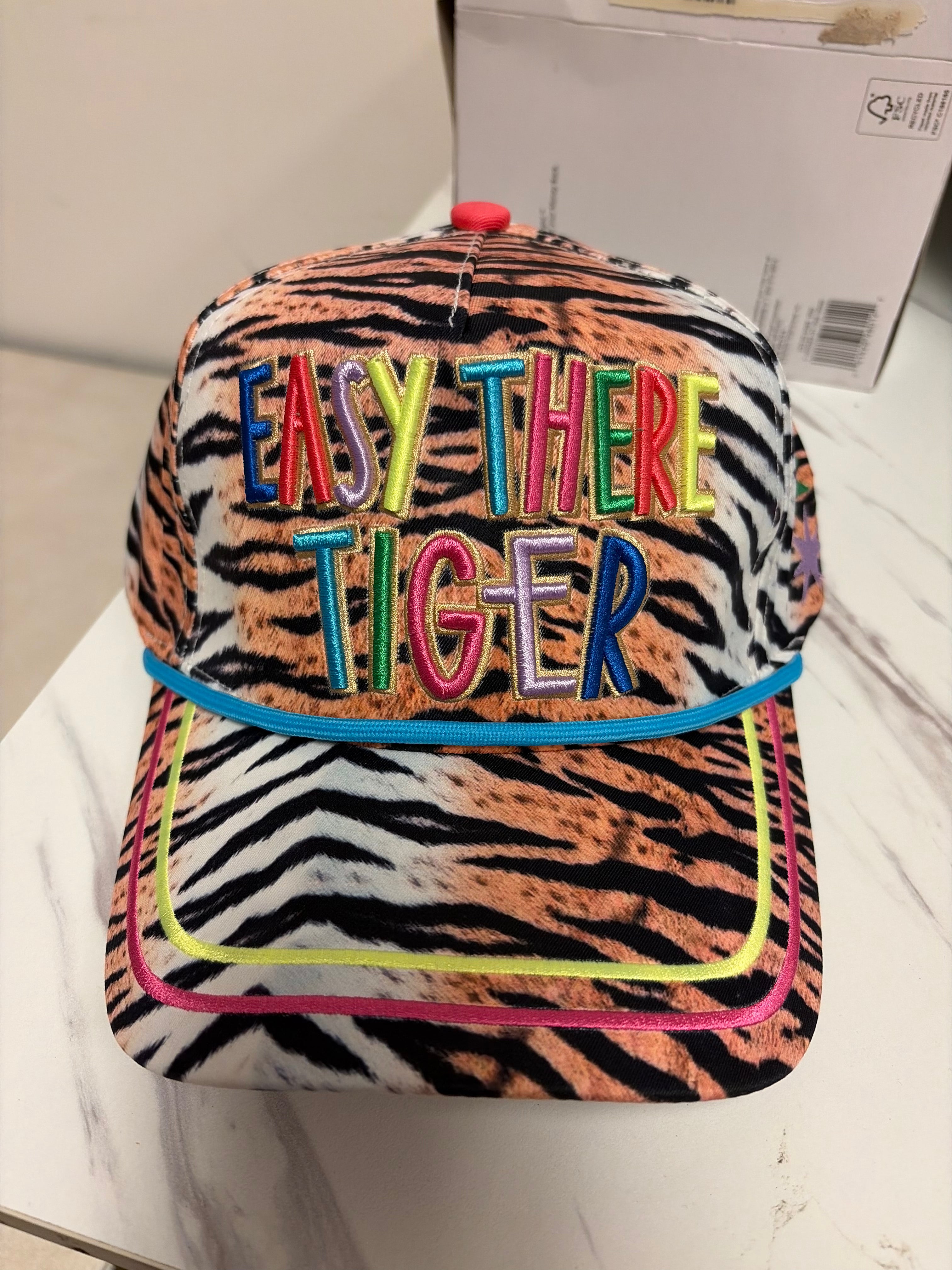 Animal print Easy There Tiger hat with colorful embroidery and bright blue rope trim.