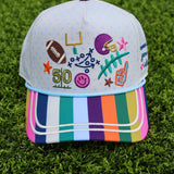 Football game day hat with playful allover doodle graphics and contrasting striped bill.