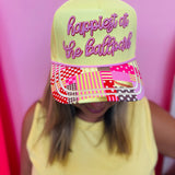 Yellow ballpark hat with pink embroidery, softball details, hearts, and playful designs.
