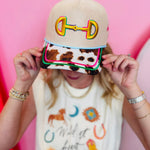 Canvas horse bit hat with yellow embroidery, horse-print bill, and colorful stars.