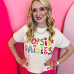 Ivory cropped graphic tee with colorful Oopsie Daisies lettering and retro floral design