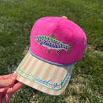 Pink faux suede hat with fish embroidery, striped bill, and Reel-y Busy detail.