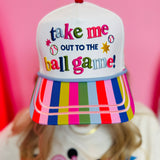 White baseball hat with colorful embroidery, striped bill, and ballpark-themed details.