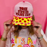 Canvas softball hat with Three Strikes You're Out embroidery and yellow polka dot bill