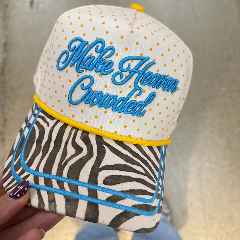 Poppy and Pine Cream polka dot faith hat with blue “Make Heaven Crowded” embroidery and zebra print bill.