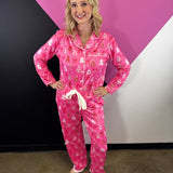 Hot pink Christmas pajama set with trees, bows, white piping and ruffle trim.
