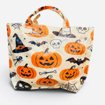 Halloween tote bag with orange jack-o'-lanterns, witch hats, bats, skulls, spiders, and spiderwebs.
