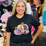 Black tee with colorful pink, turquoise, orange, and purple patterned pumpkins.