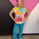 Cream sleeveless sweater with colorful watercolor pumpkin print and rounded neckline