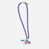 Purple beaded necklace with orange accents and colorful fish, sardine, and lobster charms.