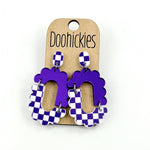 Purple checkered acrylic dangle earrings with hypoallergenic stainless steel settings.
