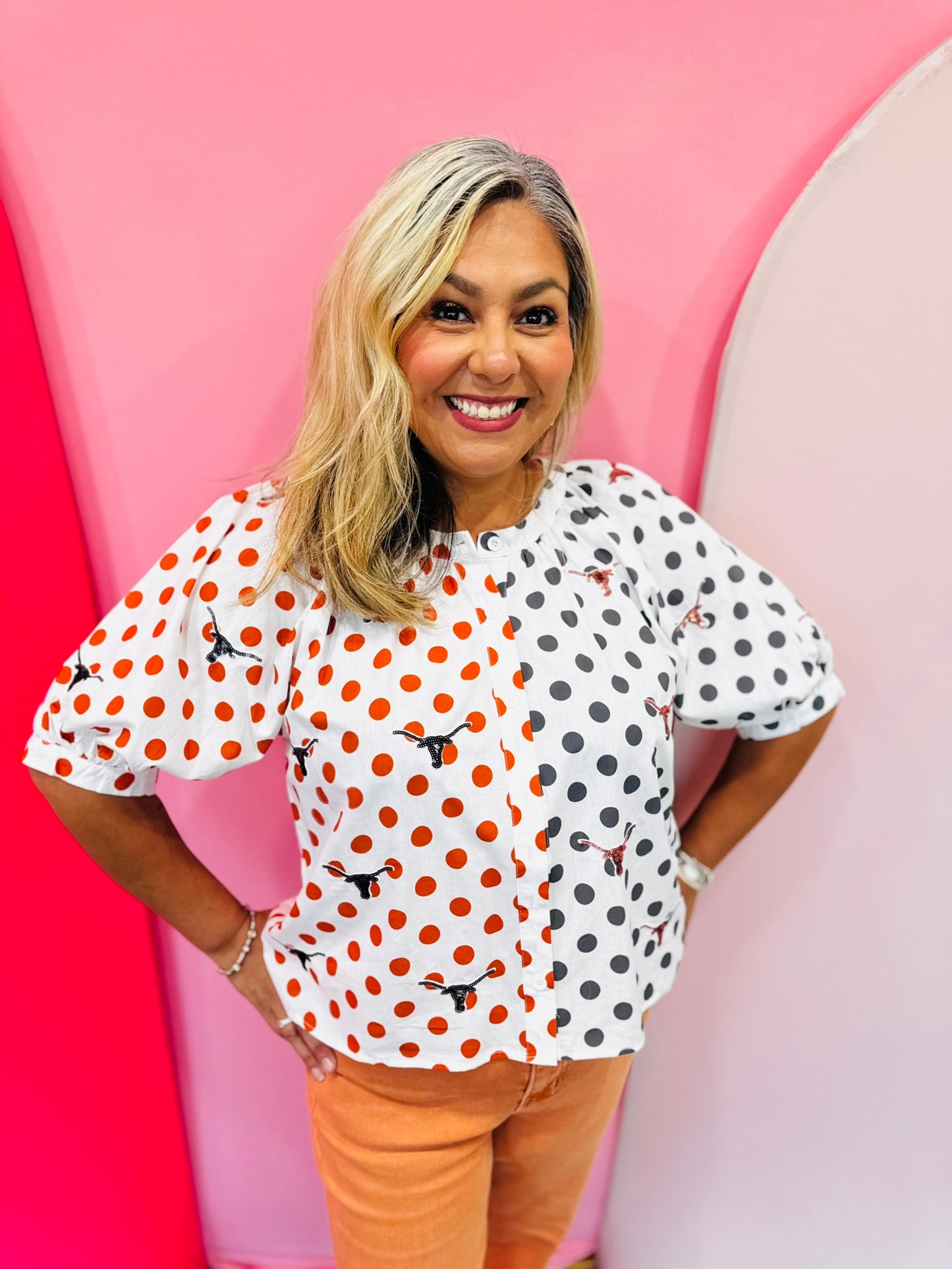 Queen of Sparkles Texas mascot colorblock polka dot button-up top with puff sleeves.
