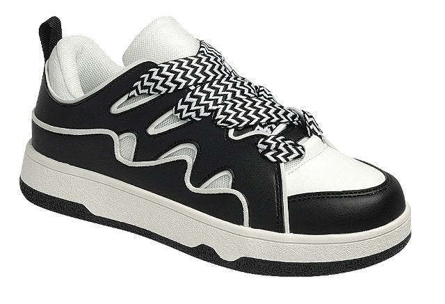 Black and white sneakers with a bold wave design, thick platform sole, and zigzag laces — modern, sporty, and edgy.