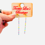 Rainbow drop earrings with gold stud and colorful beaded strands.