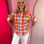 Multicolor gingham blouse with puff sleeves and striped collar details.