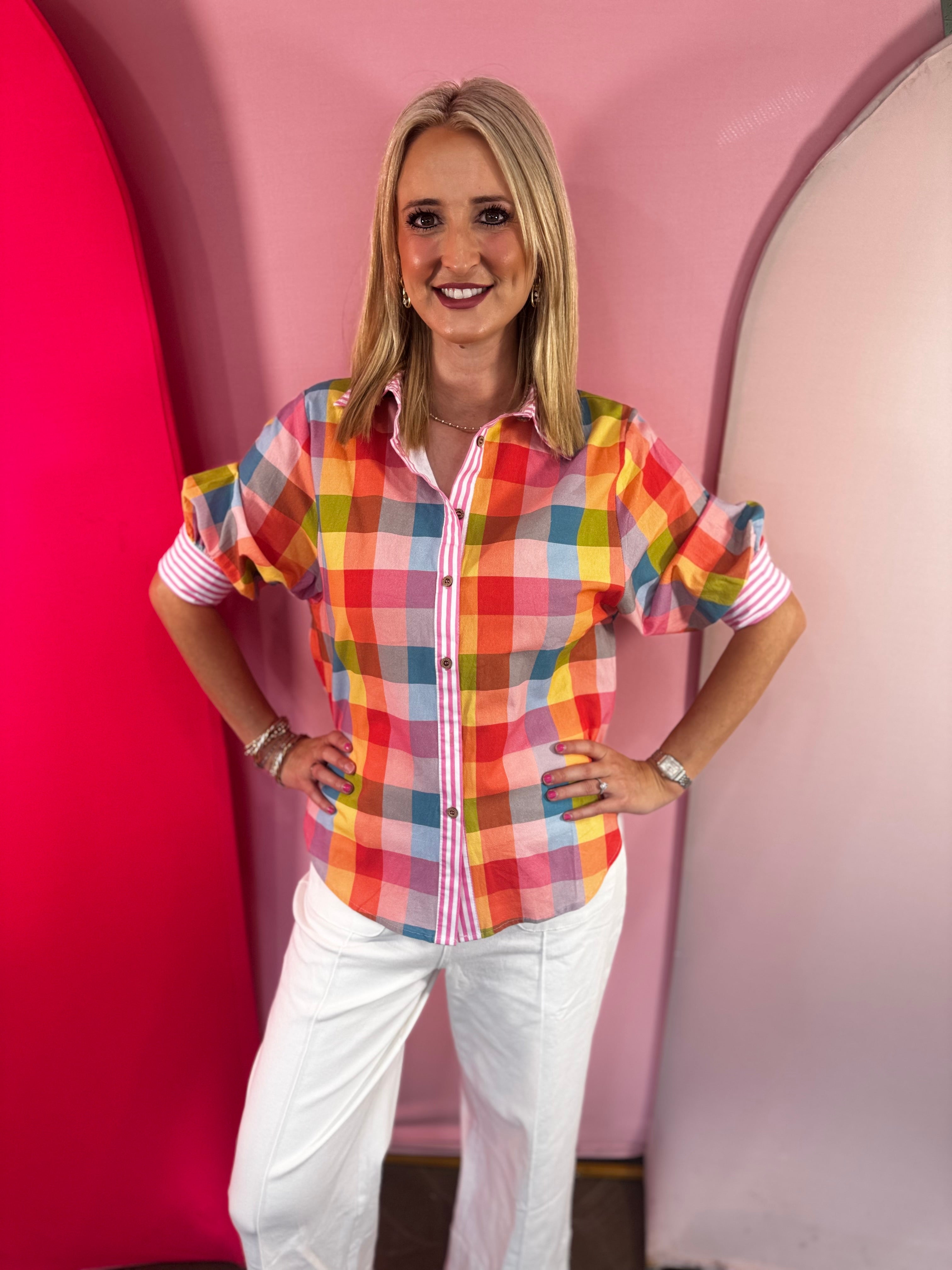 Multicolor gingham blouse with puff sleeves and striped collar details.