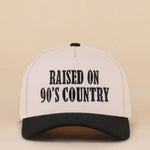 Two-tone snapback hat with Raised On 90's Country embroidered detail.