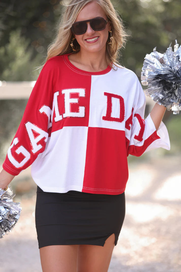 Red and white game day color block top with chenille and sequin patches and trendy cropped fit. 