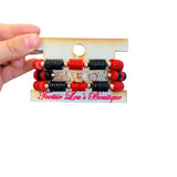 Black and red Game Day bracelet stack with gold charm accents.
