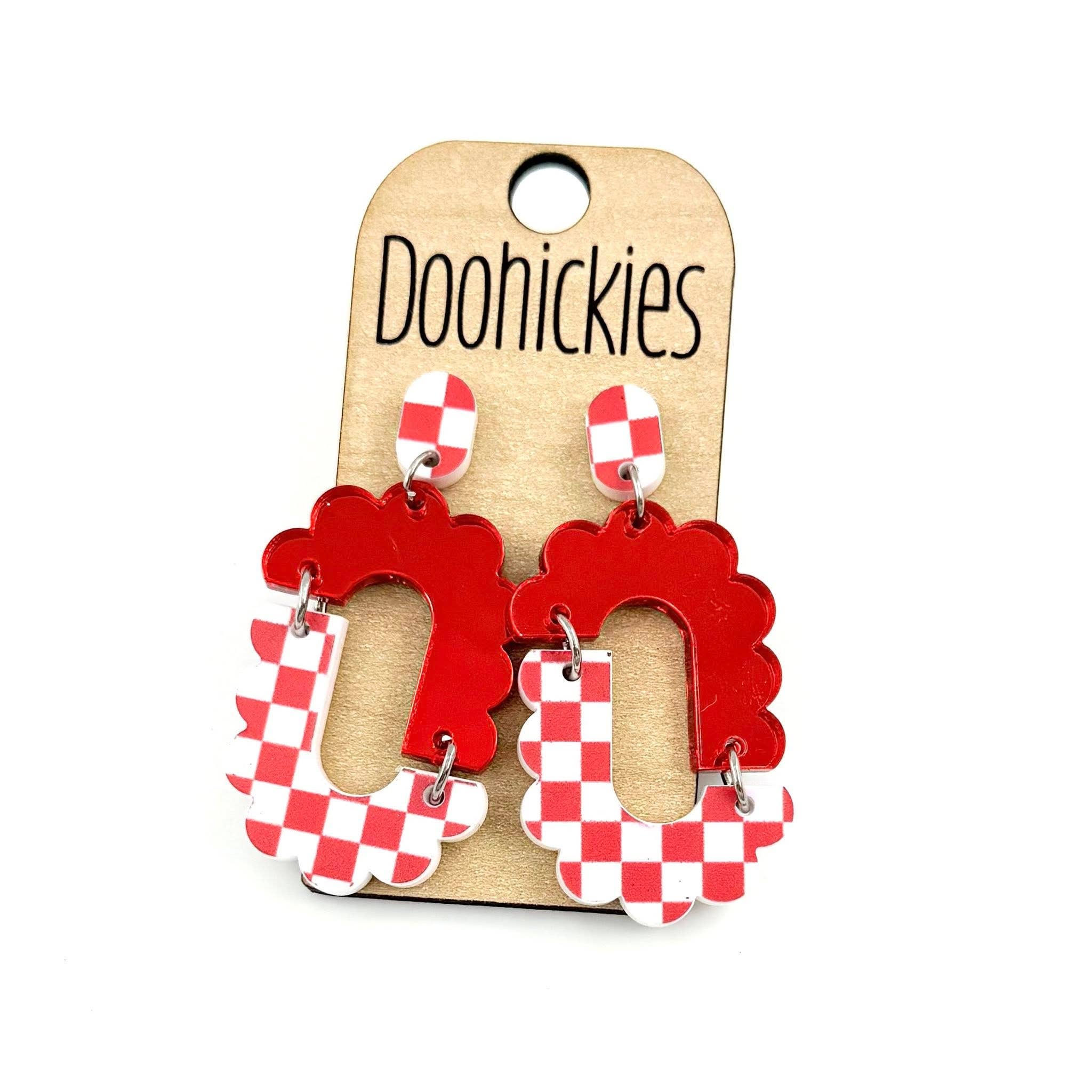 Red checkered acrylic dangle earrings with hypoallergenic stainless steel settings.