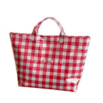 Red gingham checkered tote bag with water-resistant PVC and Velcro closure. 