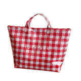 Red gingham checkered tote bag with water-resistant PVC and Velcro closure. 