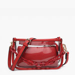 Clear crossbody bag with red trim, chain strap, and removable inner pouch